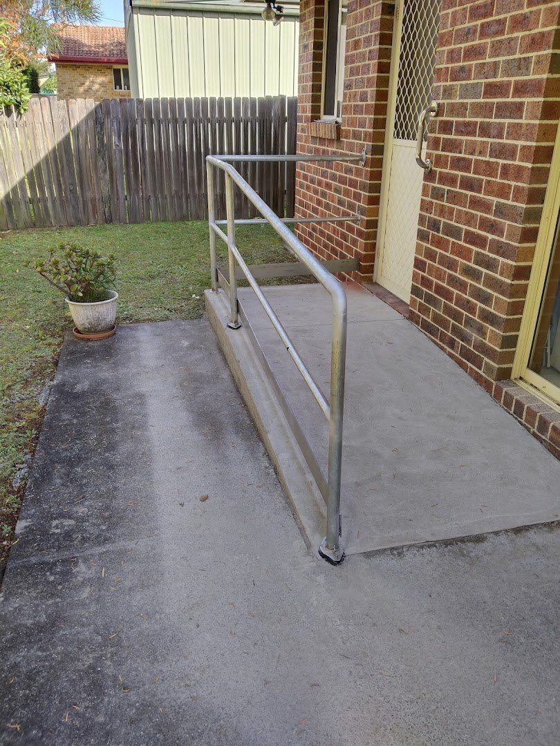 An access ramp and handrail by the back door